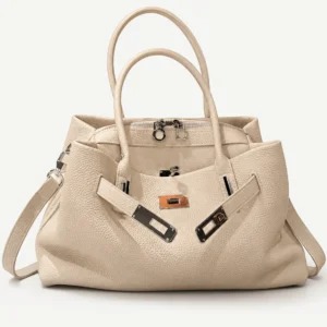 Cream leather bowling tote on a pale studio background