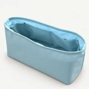 Light blue fabric folded satchel organizer showing the actual pocket construction