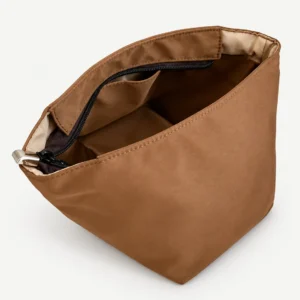 Brown fabric zip-top bucket bag organizer showing the actual pocket construction