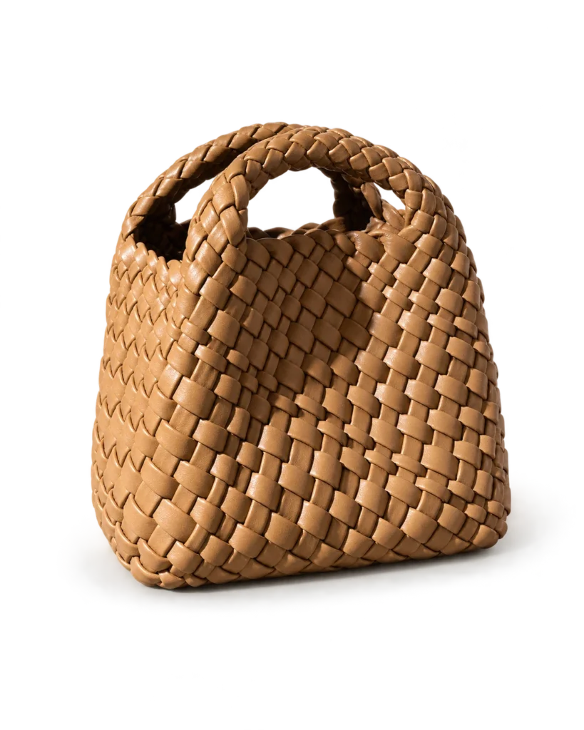 Biscuit mini woven phone bag on a pale studio background