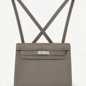Taupe soft leather flap bag on a pale studio background