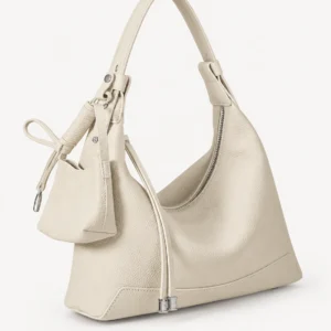 Cream leather hobo bag on a pale studio background