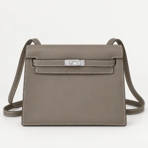 Taupe convertible leather flap bag with naturally resting straps and contrast stitching