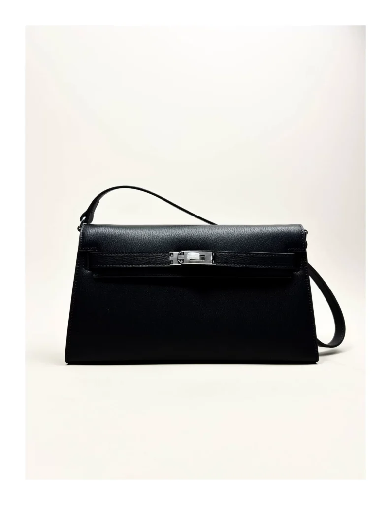The Evening — Elongated Leather Shoulder Bag — Black / Silver-tone