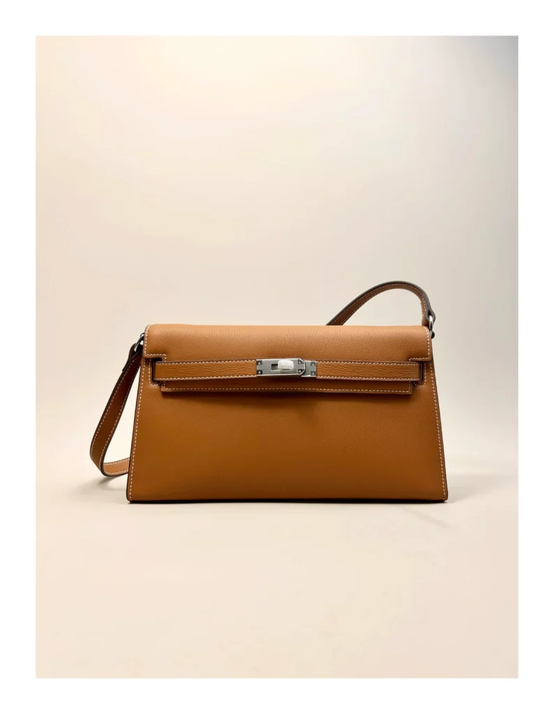 The Evening — Elongated Leather Shoulder Bag — Tan / Silver-tone