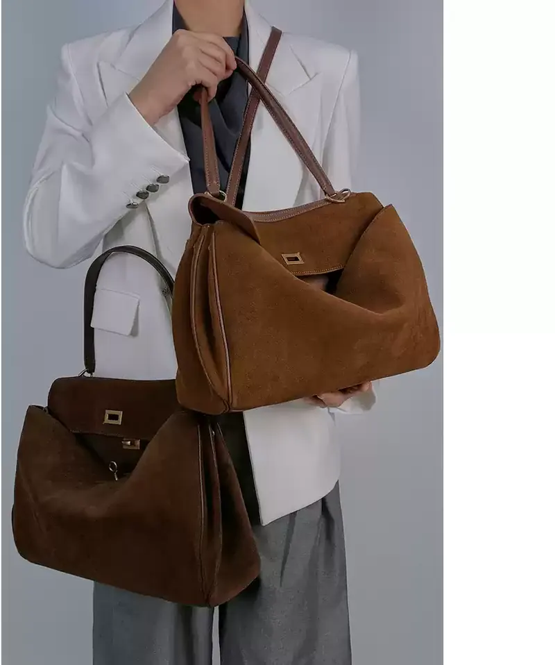 MONA STUDIO large chestnut brown suede shoulder tote shown on a model