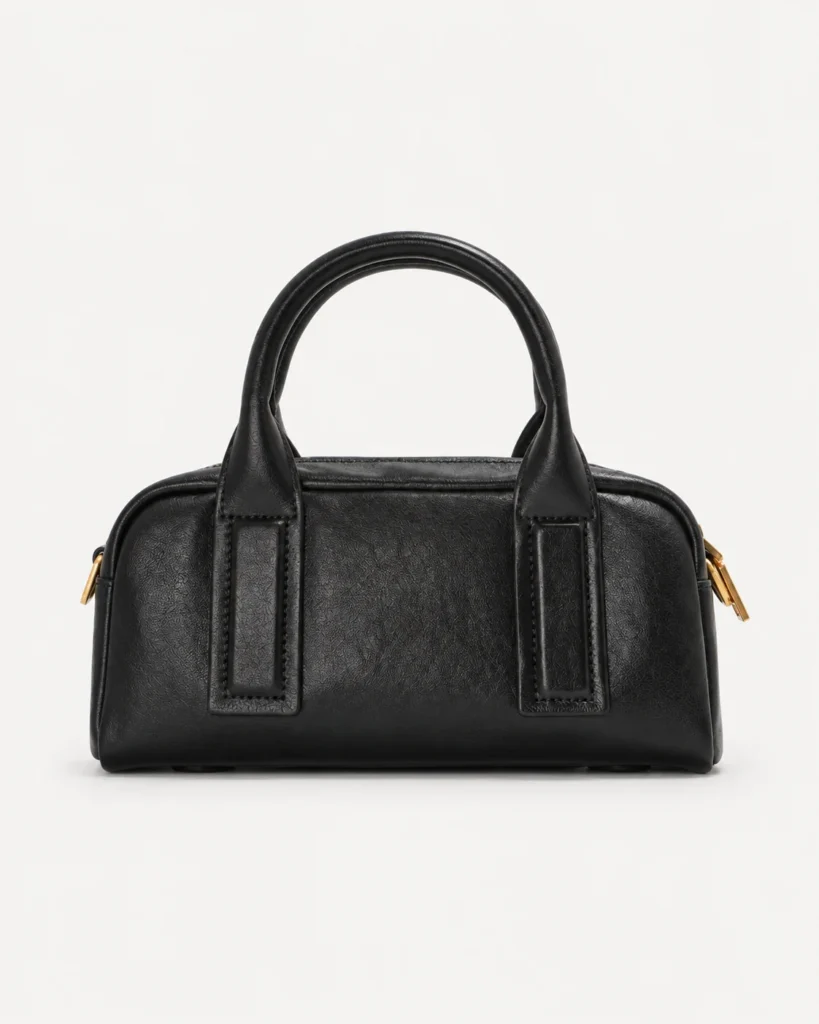 The Toast — Compact Leather Bowling Bag in Black — product color photograph