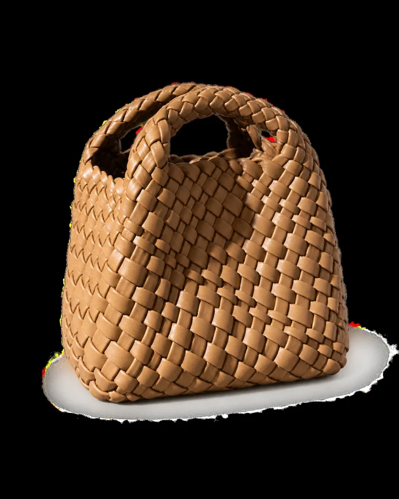 Biscuit mini woven phone bag on a pale studio background